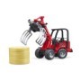 Bruder incarcator compact Schaffer 2630 cu graifer si un balot rotund